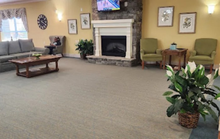 Cozy living room with a fireplace and comfortable seating.
