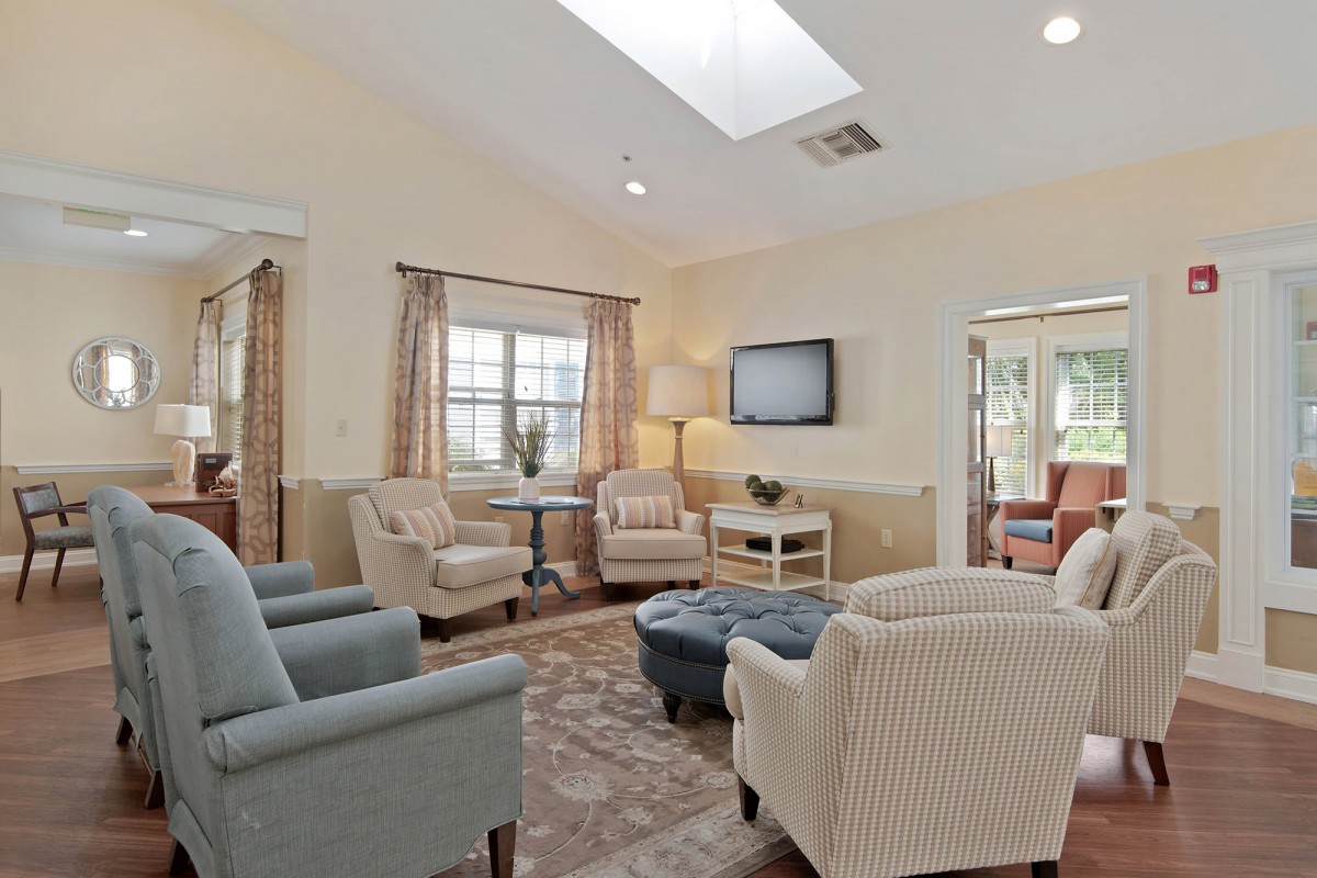 A cozy living room featuring comfortable seating and natural light.