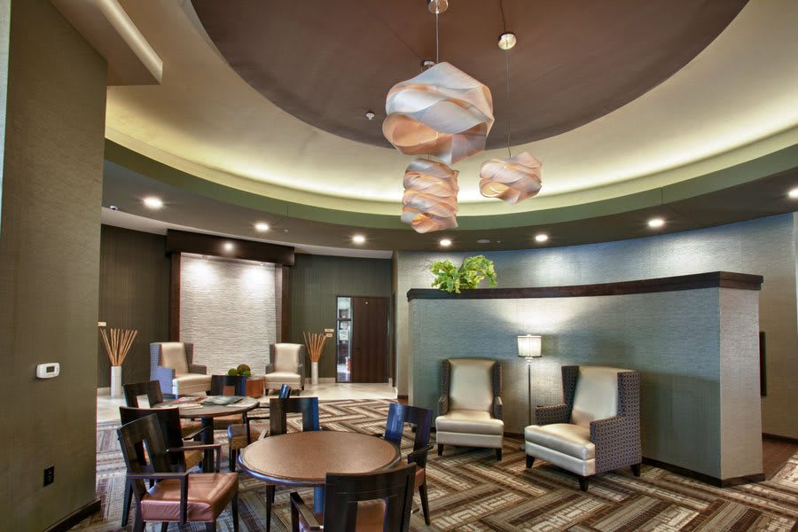 A modern lobby with stylish seating and contemporary lighting fixtures.
