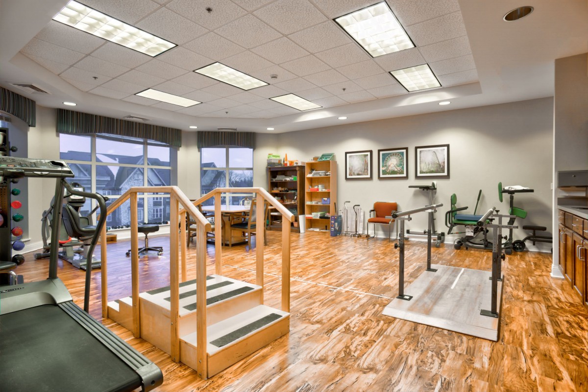 A well-equipped physical therapy and rehabilitation room with exercise equipment and training facilities.