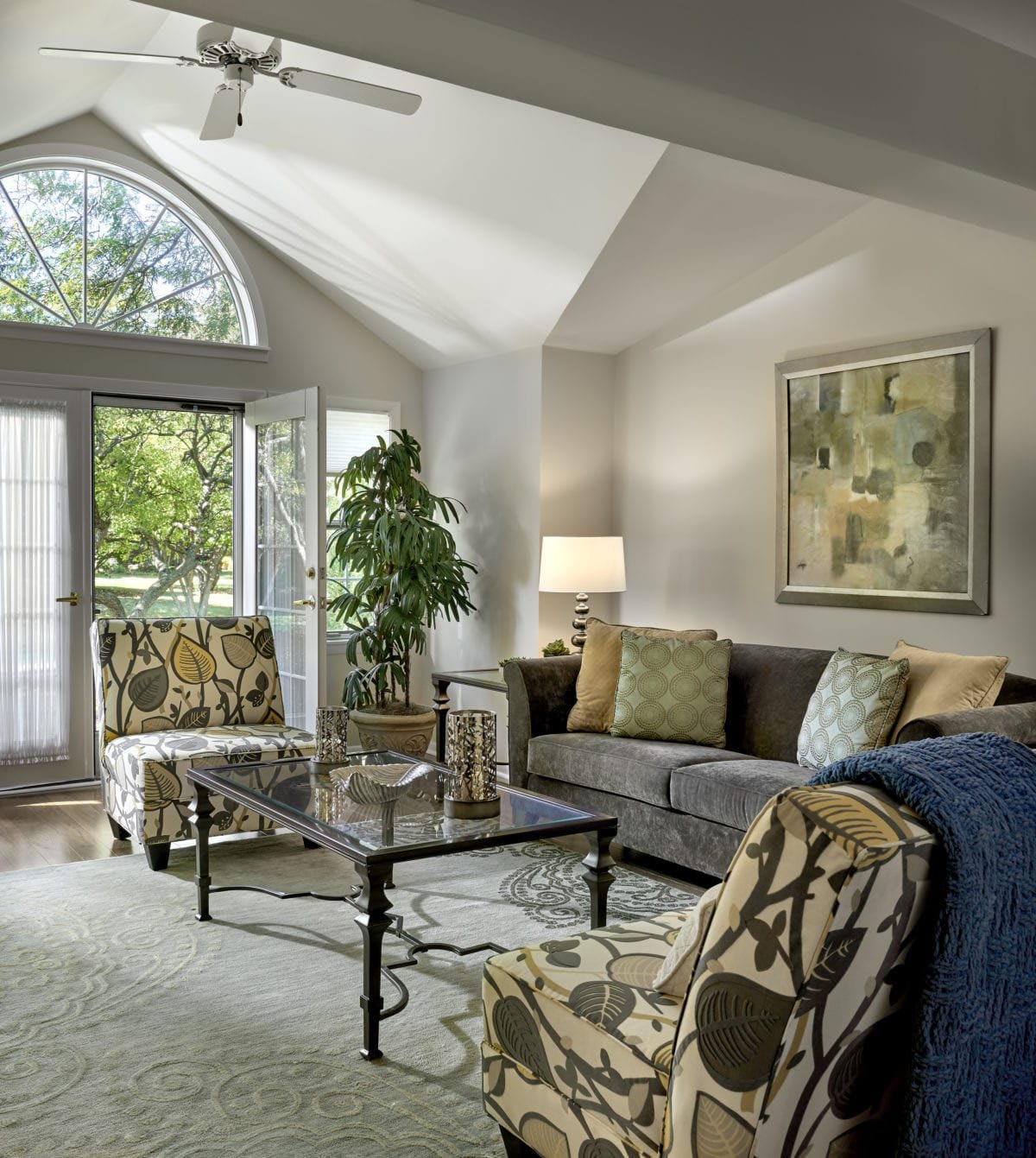 A cozy living room with modern decor and ample natural light.