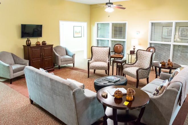 A cozy living room with comfortable seating and a warm ambiance.
