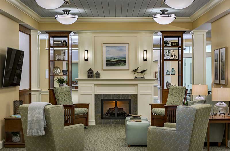 A cozy living room with a fireplace and elegant decor.