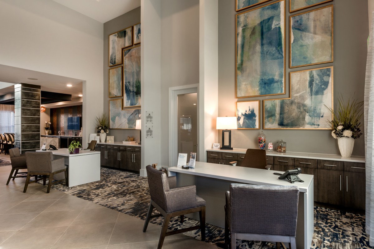 A modern office space featuring contemporary artwork and stylish furnishings.