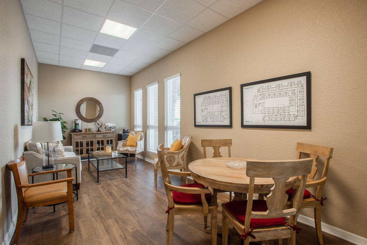 A cozy dining area with wooden furniture and decorative elements.