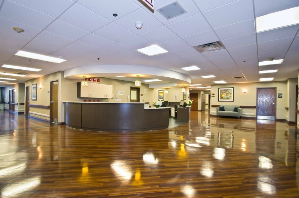A spacious and modern lobby area with a reception desk.