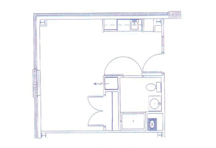 Blueprint of a small apartment layout featuring a kitchen and bathroom.