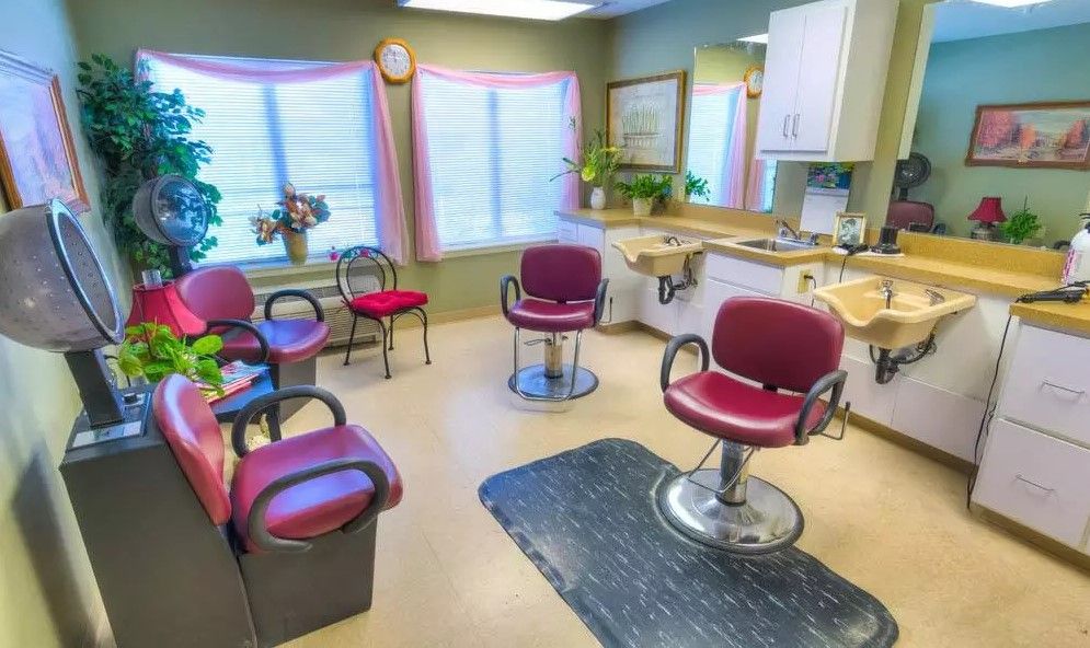 A cozy hair salon interior with chairs and mirrors, ready for clients.
