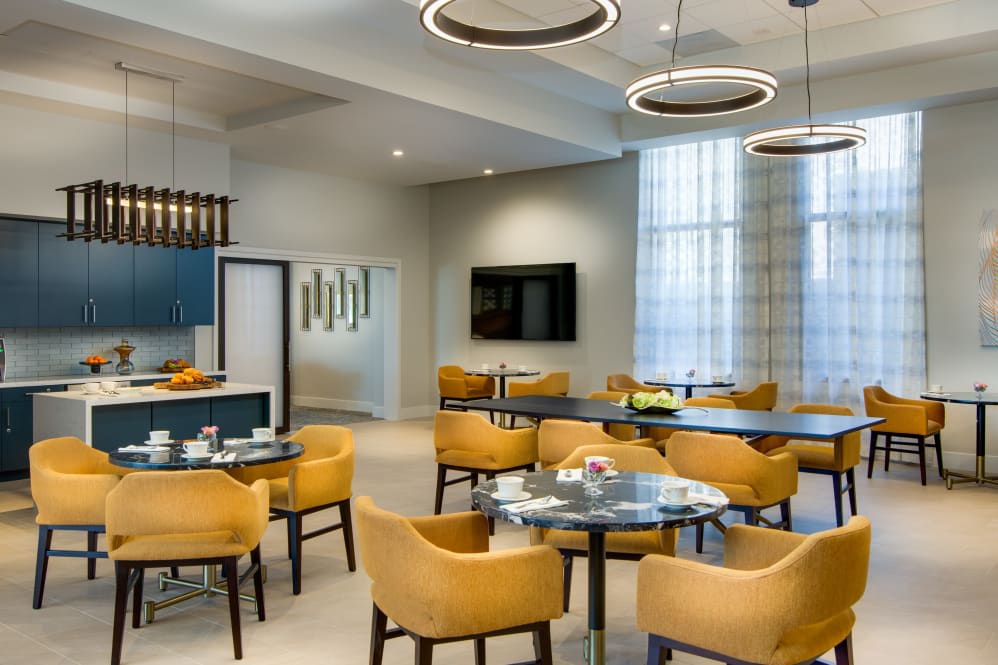 A modern dining area with comfortable seating and stylish lighting.