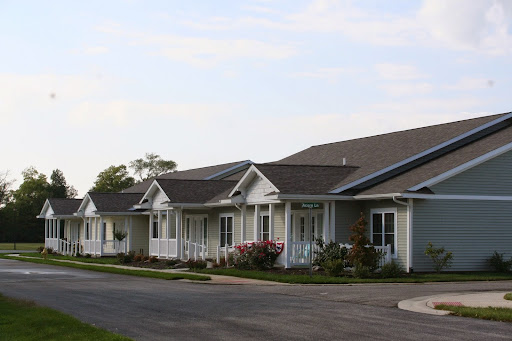 A row of charming suburban houses with well-maintained gardens.