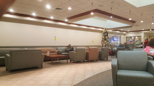A cozy waiting area featuring comfortable seating and festive decor.