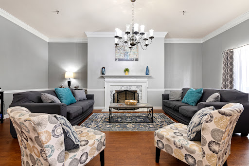 A beautifully designed living room featuring a cozy fireplace, stylish furniture, and elegant decor.