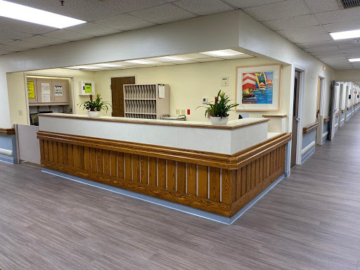 A welcoming reception area featuring wood paneling and bright, modern decor.