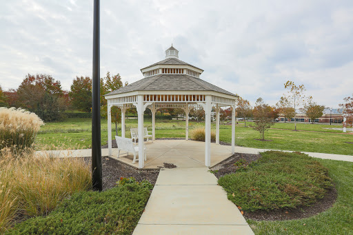 A charming gazebo in a serene park setting, inviting visitors to relax and enjoy the outdoors.