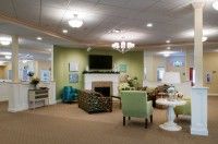 A cozy living room with a fireplace and comfortable seating.