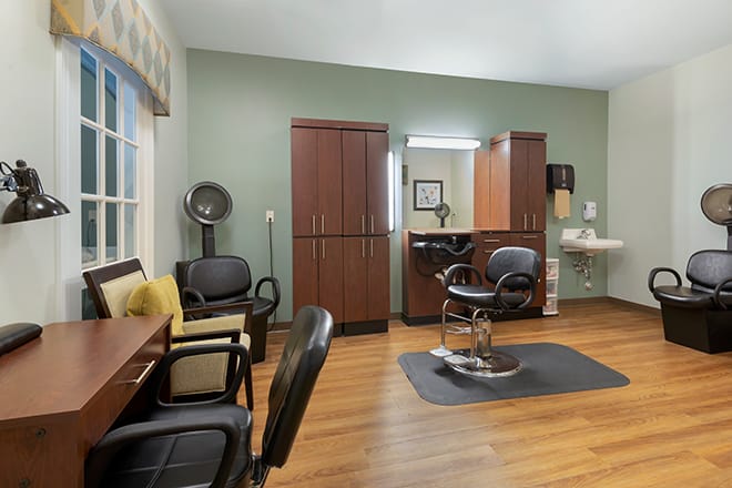 A modern hair salon with styling chairs and equipment ready for use.