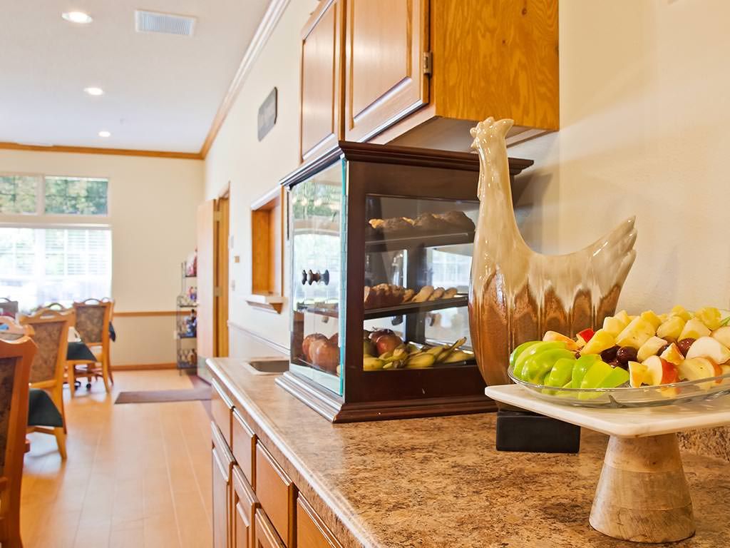 A kitchen counter adorned with a fruit bowl and decorative items.