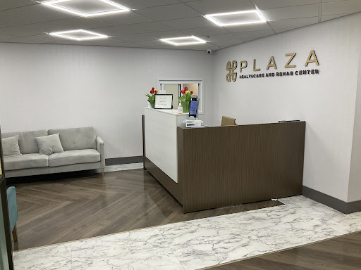 A modern reception area featuring a sleek desk and comfortable seating.