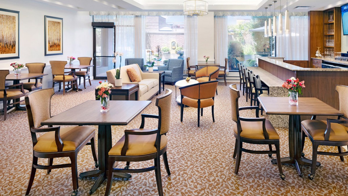 A cozy lounge area with comfortable seating and natural lighting.