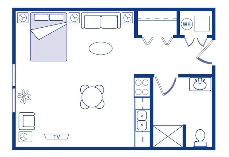 A floor plan of a studio apartment showing the arrangement of furniture and rooms, including a bed, table, kitchen area, and bathroom.