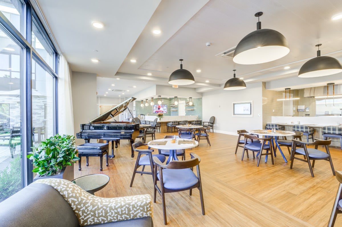 A modern cafe with comfortable seating and elegant lighting.