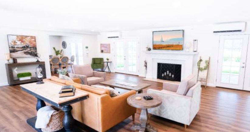 A stylish living room with modern furniture and a cozy fireplace.