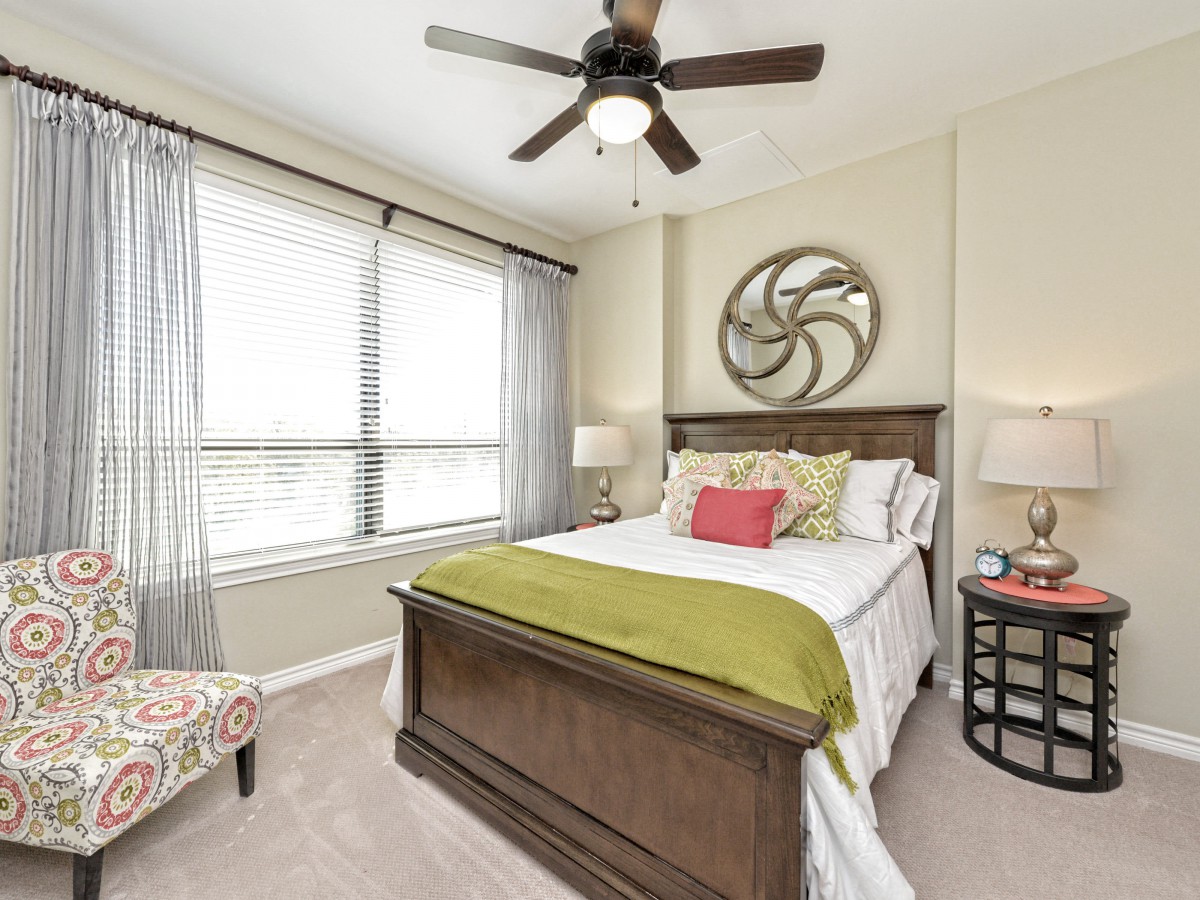 A cozy bedroom with modern decor and a comfortable bed.
