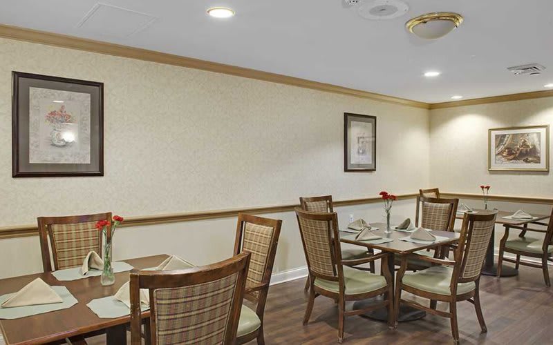 An inviting dining area with neatly arranged tables and chairs.