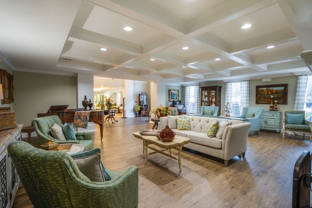 A spacious and elegantly decorated living room with comfortable seating and stylish decor.
