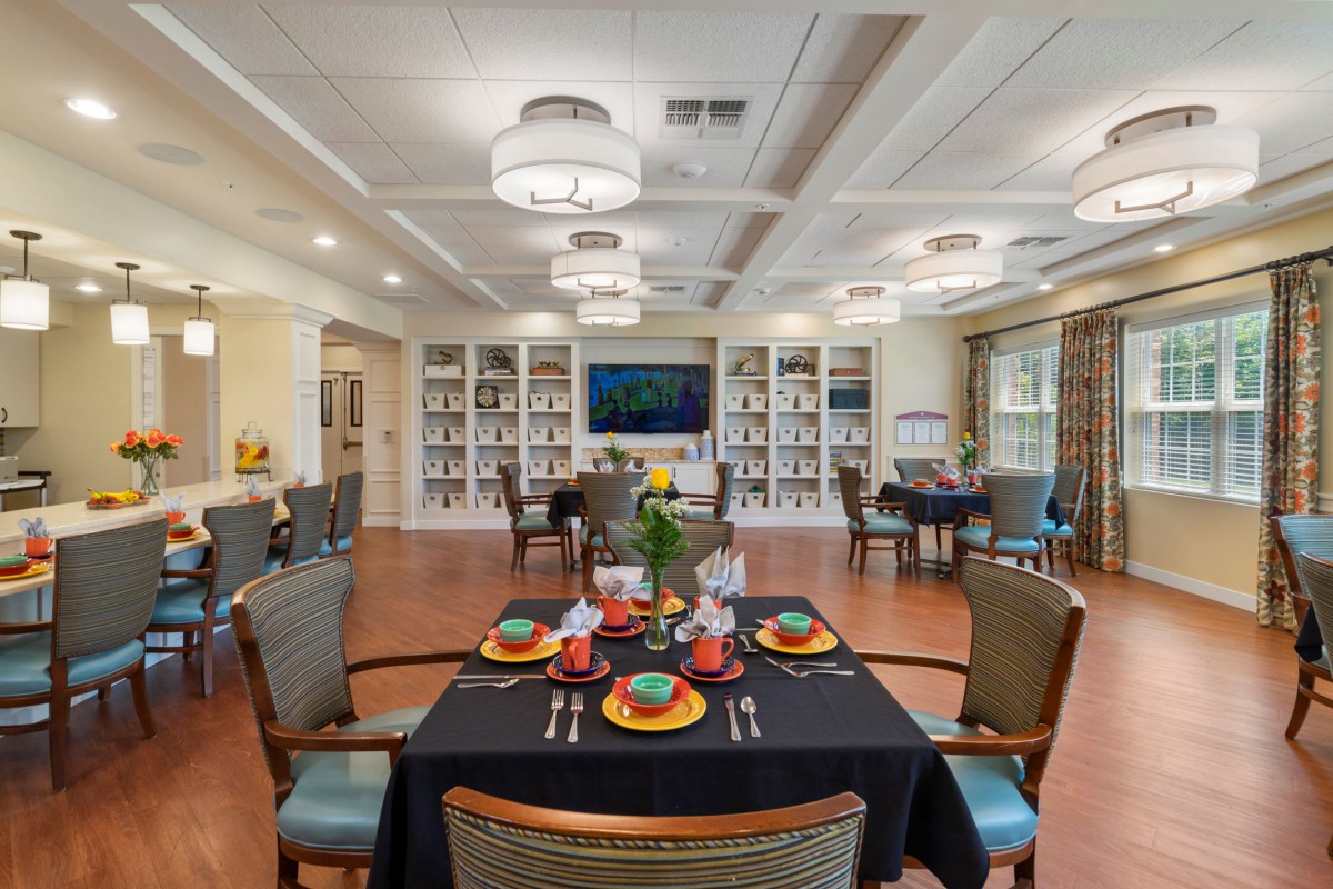 An elegantly decorated dining room with set tables and comfortable seating.