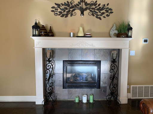 A stylishly decorated fireplace with elegant details and a cozy atmosphere.