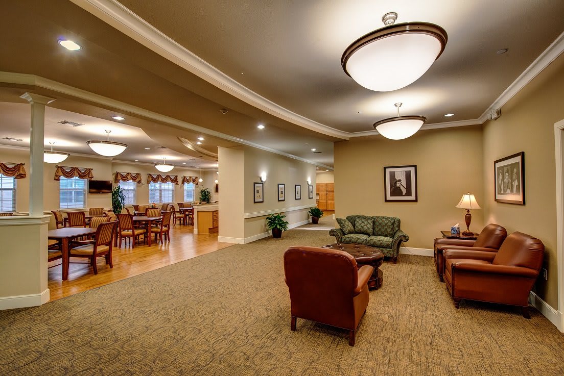 A cozy lounge area with comfortable seating and warm lighting.
