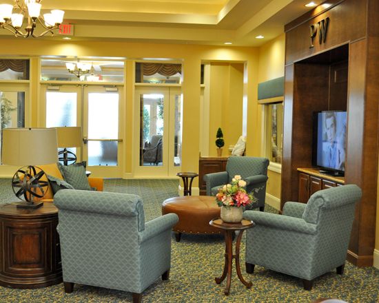 A cozy living room with comfortable seating and a television.