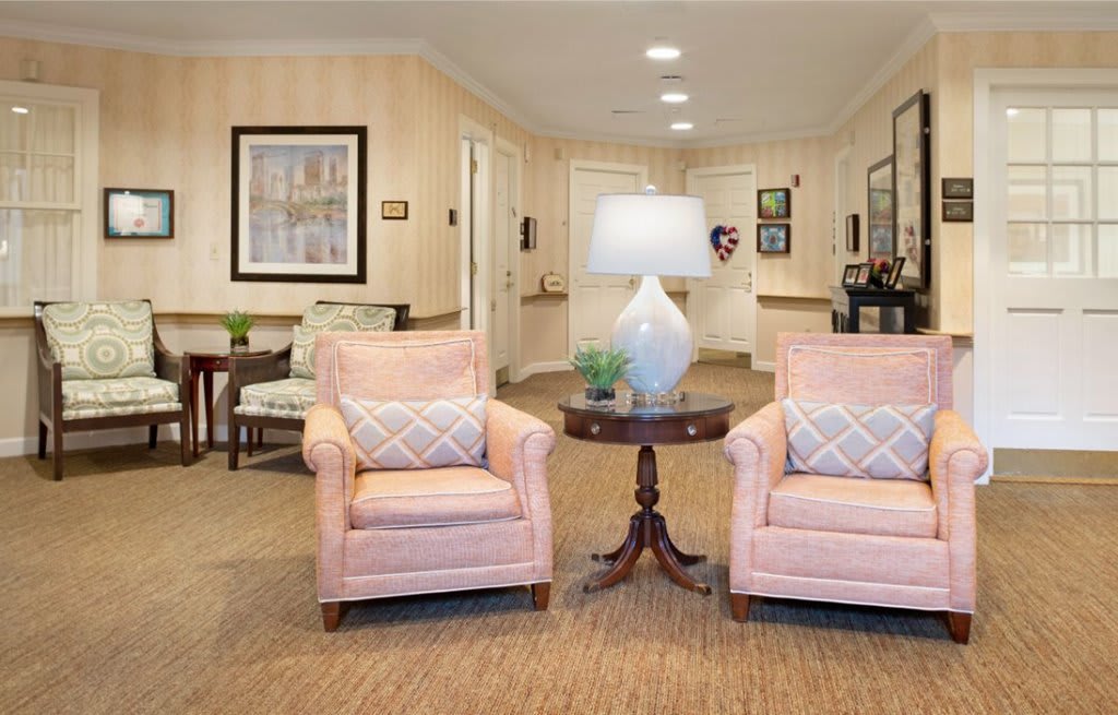 A cozy living room with comfortable seating and elegant decor.