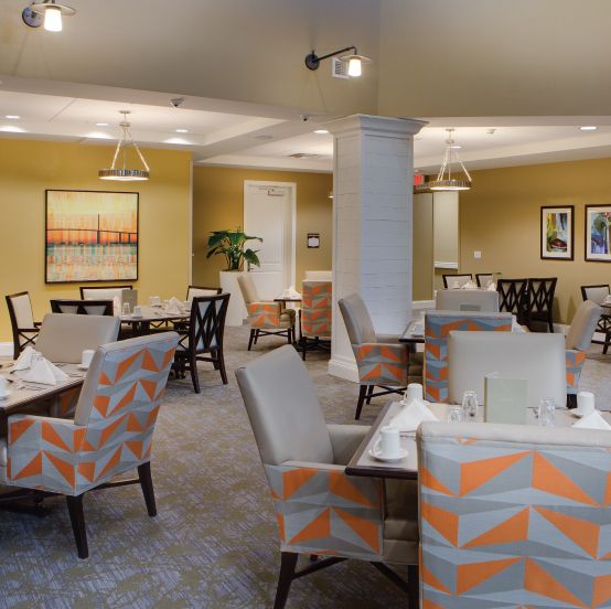 A modern restaurant dining area with stylish furniture and contemporary decor.