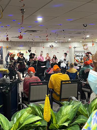 A lively community event featuring music and performance, with seniors enjoying the festivities.