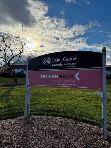 A sign for the Palm Center located at a healthcare facility, with the PowerBack program highlighted in a scenic outdoor setting.