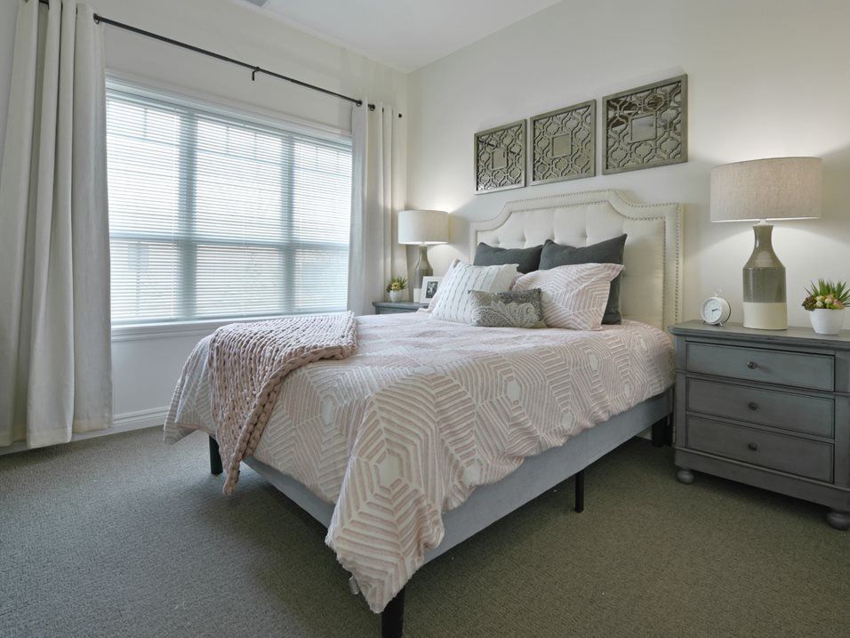 A cozy and stylish bedroom with a comfortable bed, elegant nightstands, and soft lighting.