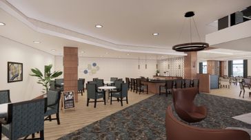 Modern restaurant interior with dining area and bar.