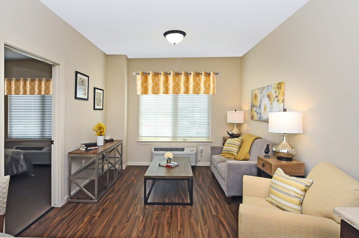 A cozy living room with modern decor and warm tones.