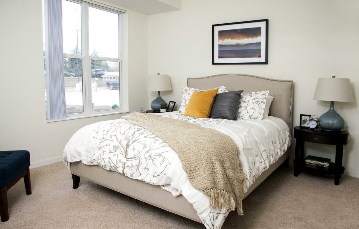 Cozy bedroom with stylish decor and a comfortable bed.