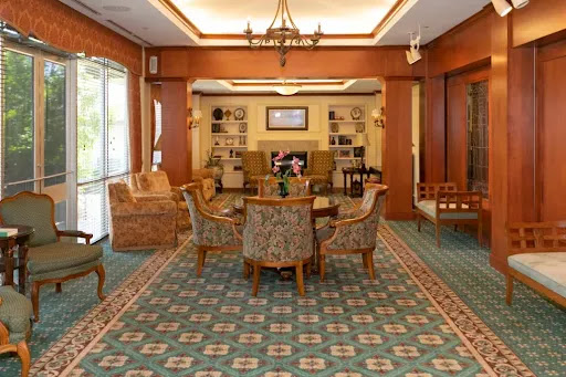 A cozy lobby area featuring comfortable seating and warm decor.