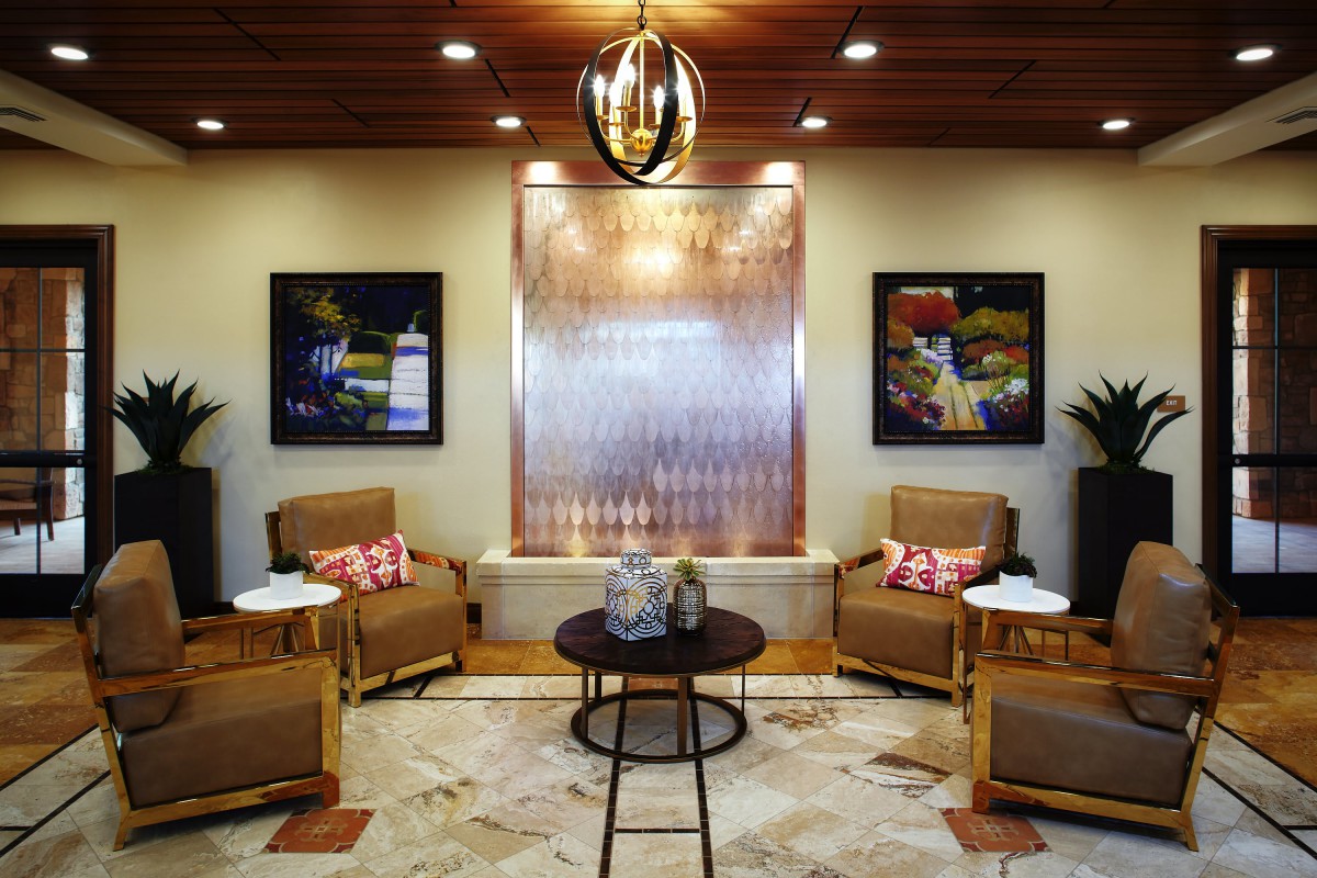 A modern lobby with comfortable seating and decorative artwork.