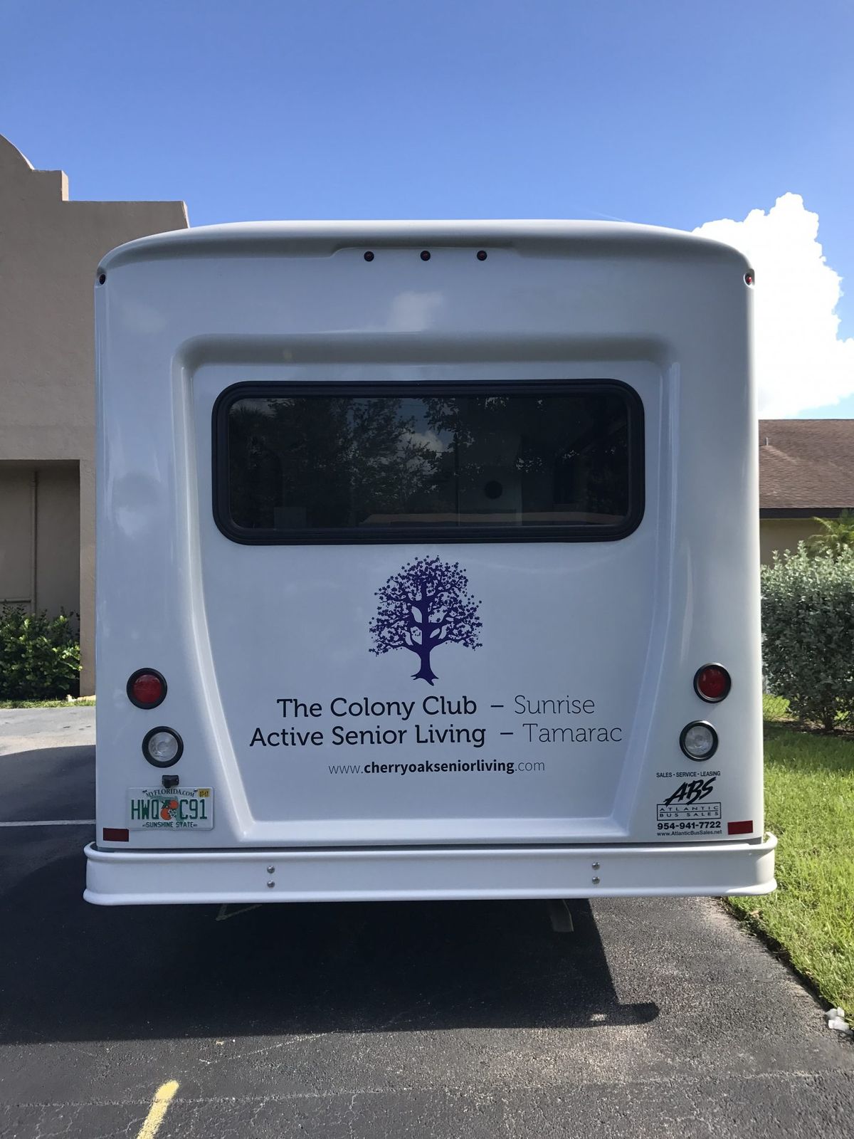 Rear view of a bus with signage promoting active senior living.