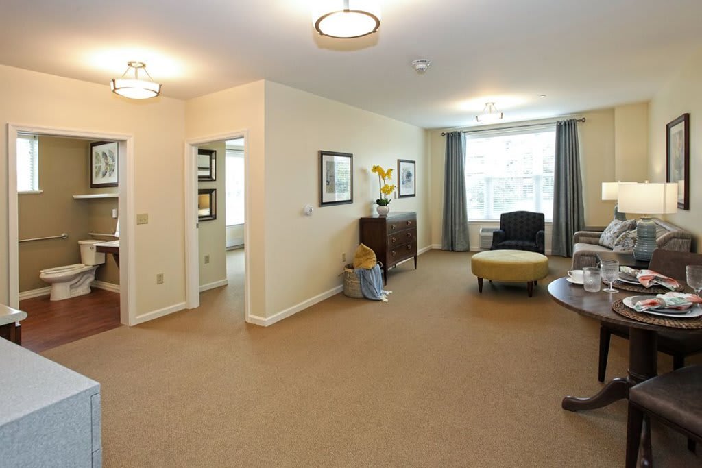 A spacious living room with modern decor and plenty of natural light.