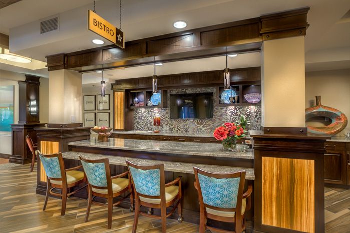 A modern hotel lobby bar with stylish seating and elegant lighting.