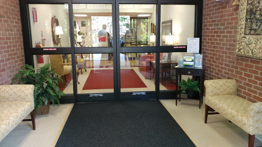 An inviting entrance displaying a stylish lobby with comfortable seating and decorative elements.