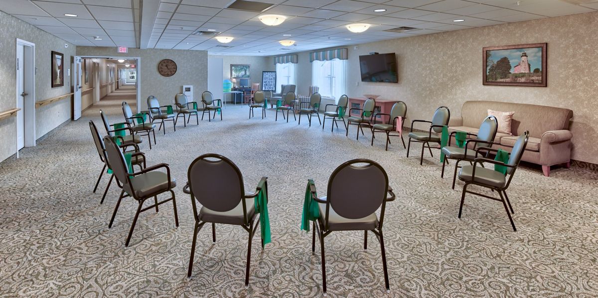 A spacious meeting room with chairs arranged in a circle.