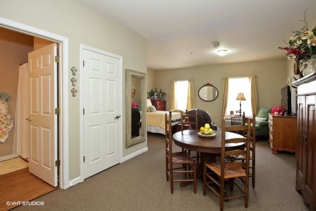 A cozy living space featuring a dining area, comfortable seating, and tasteful home decor.