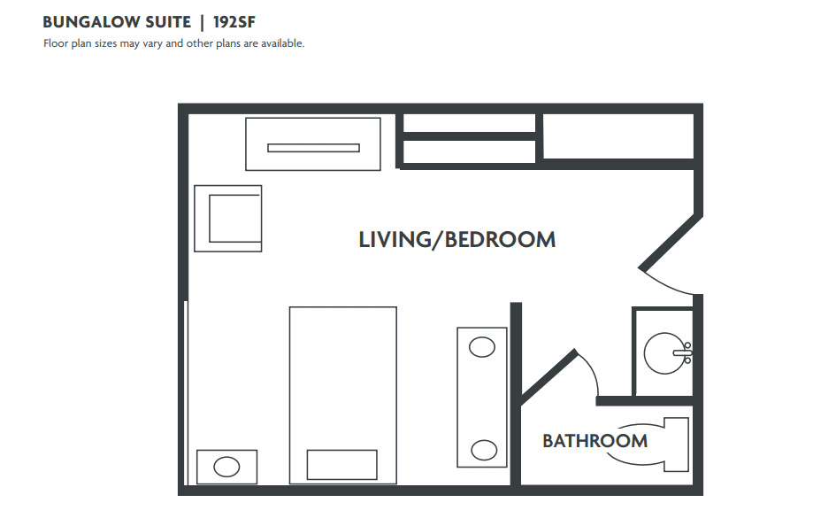 A floor plan of a single suite with an integrated living and bedroom area, featuring a separate bathroom.